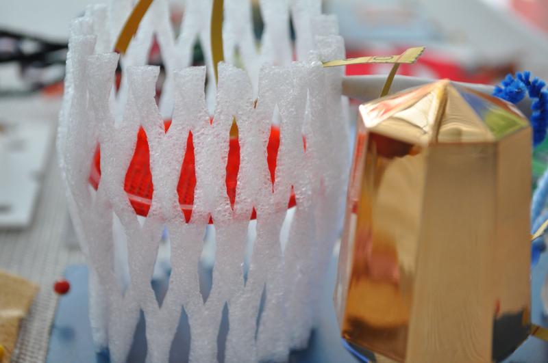 Plastic found materials such as lids and mesh.