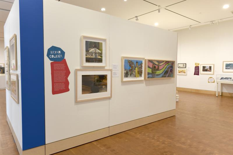 Installation image showing walls with framed art.