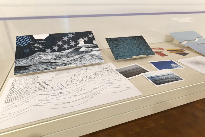 Installation image showing walls with framed art.