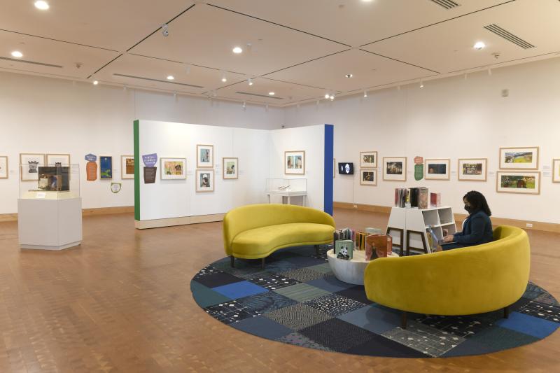 Installation image showing walls with framed art.