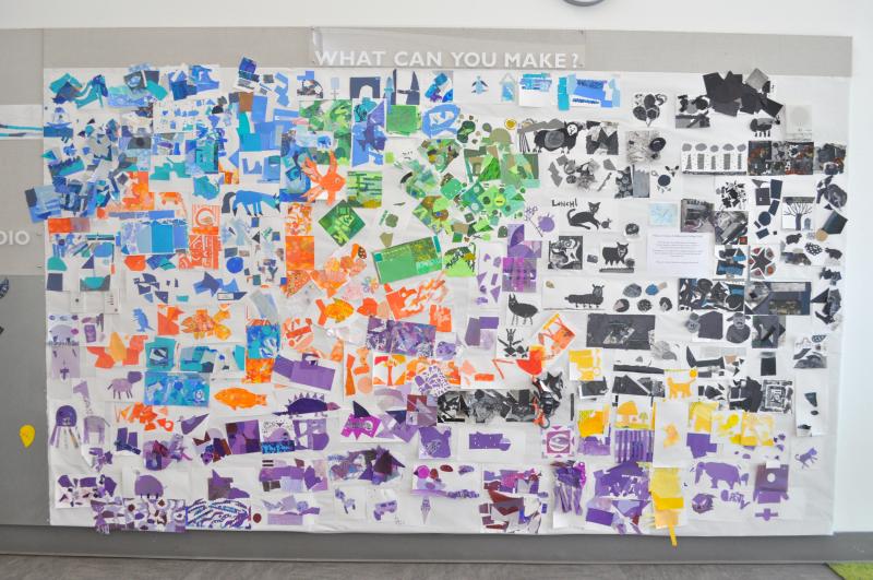 A wall covered in colorful collages.