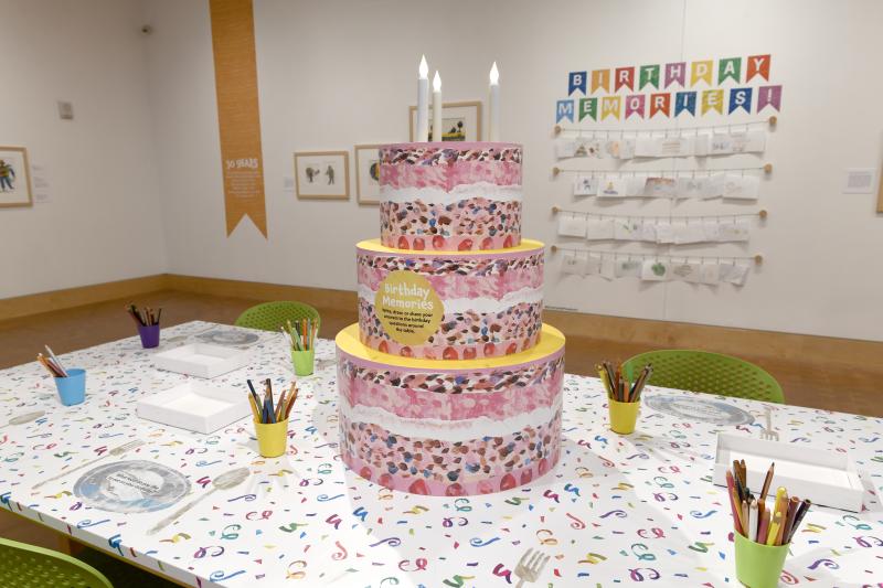 Installation image showing walls with framed art.