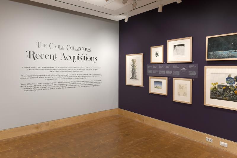 Installation image showing walls with framed art.