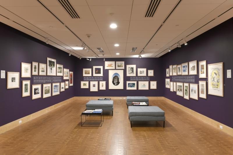Installation image showing walls with framed art.