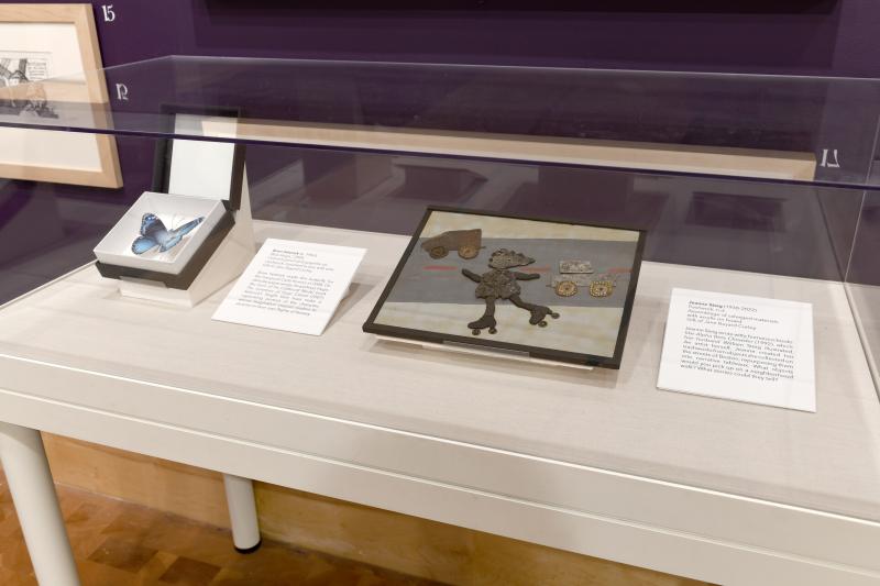 Installation image showing walls with framed art.