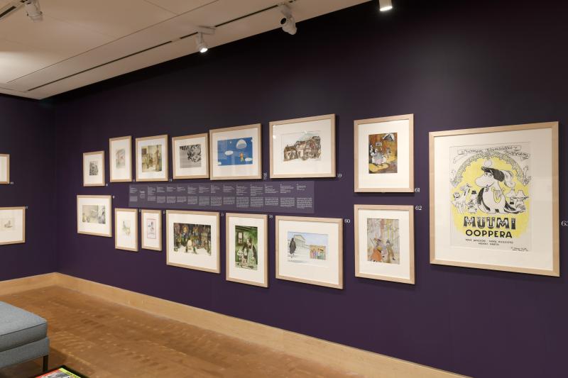 Installation image showing walls with framed art.