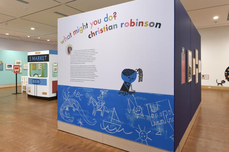 Installation image showing walls with framed art.