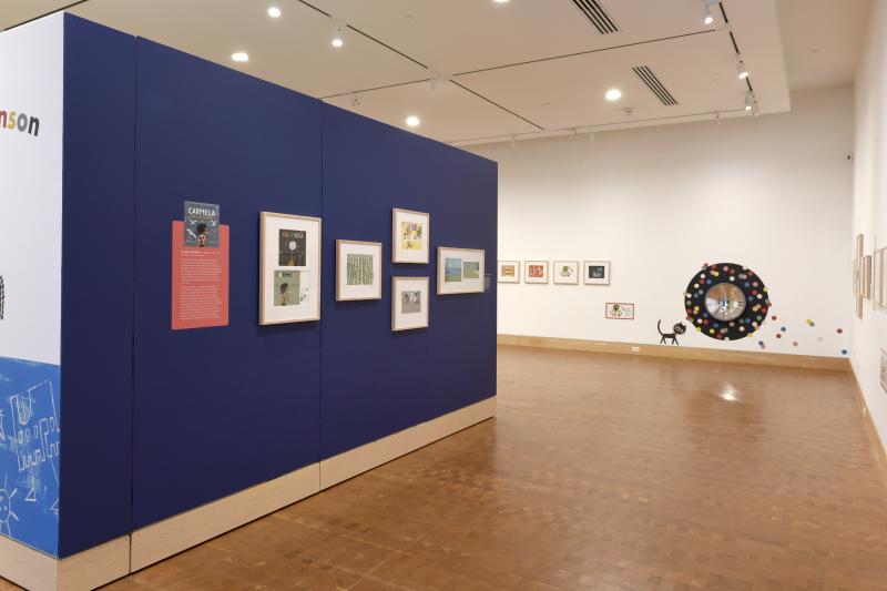 Installation image showing walls with framed art.