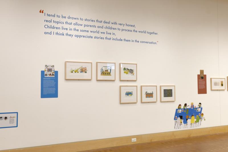 Installation image showing walls with framed art.