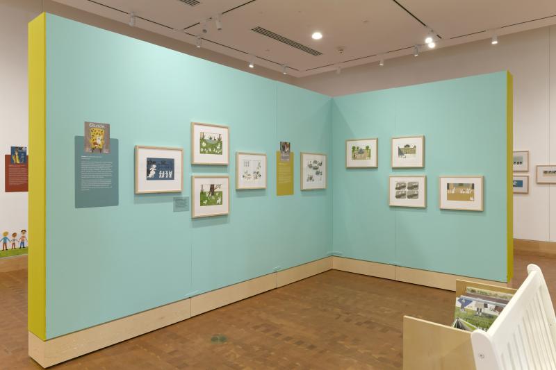Installation image showing walls with framed art.