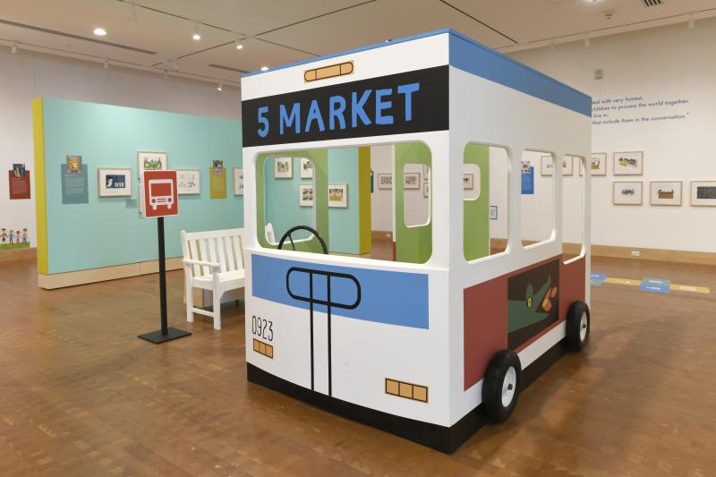 Installation image showing walls with framed art.
