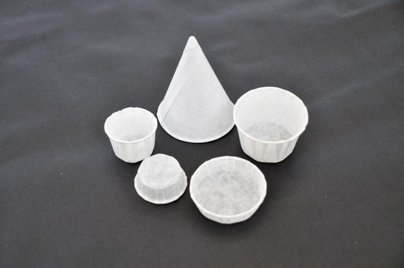 A paper cone and various-sized paper cups