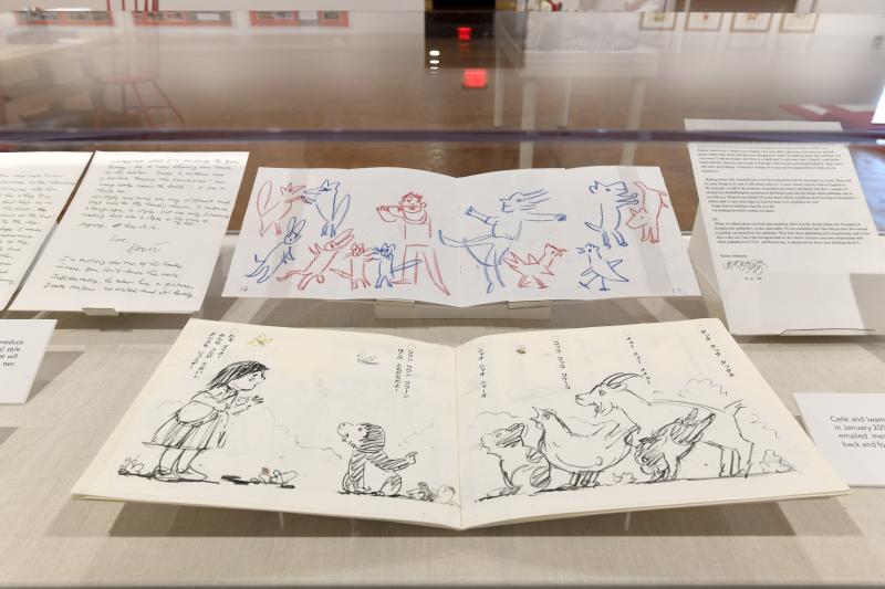 Installation image showing walls with framed art.