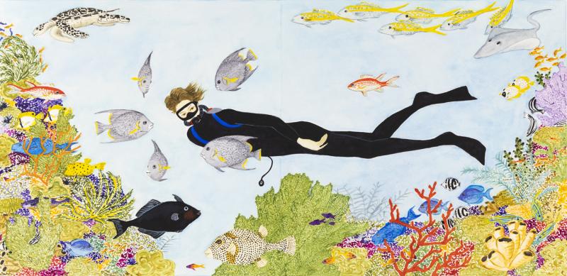 a female scuba diver swims with the fish around her.