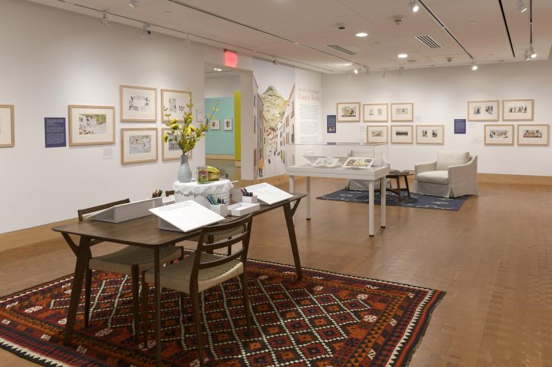 Photograph of gallery showing framed art and graphics.