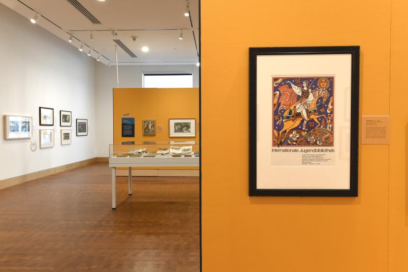 Photograph of installation showing art on walls.