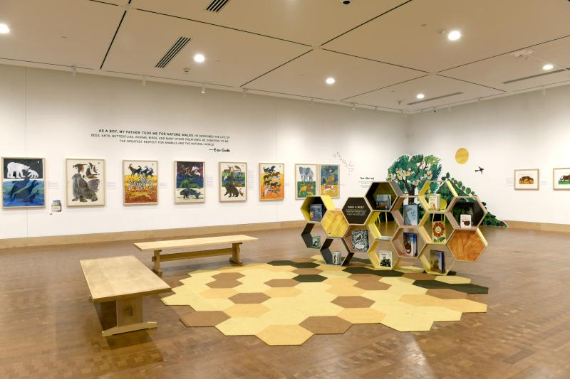 Photograph of gallery showing framed art and graphics.