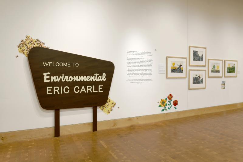 Photograph of gallery showing framed art and graphics.