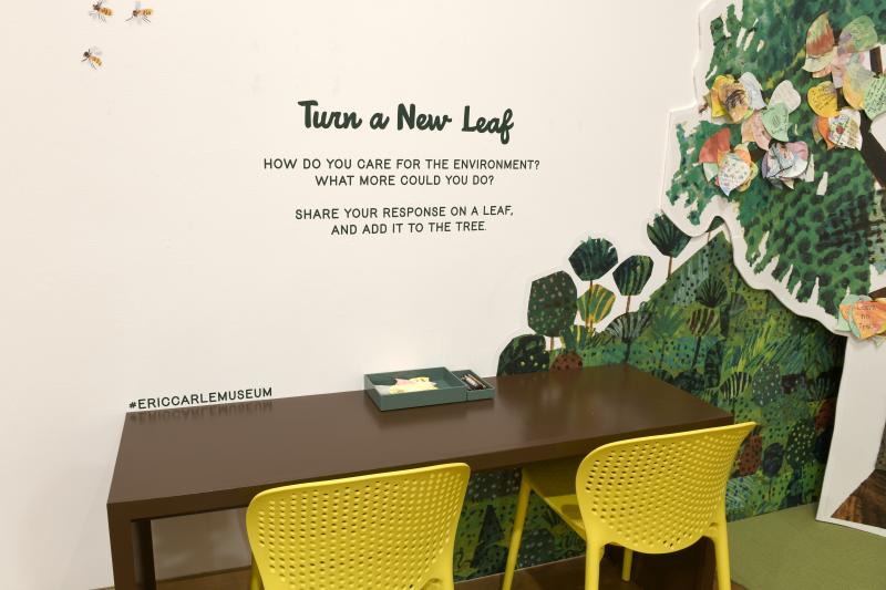 Photograph of gallery showing framed art and graphics.