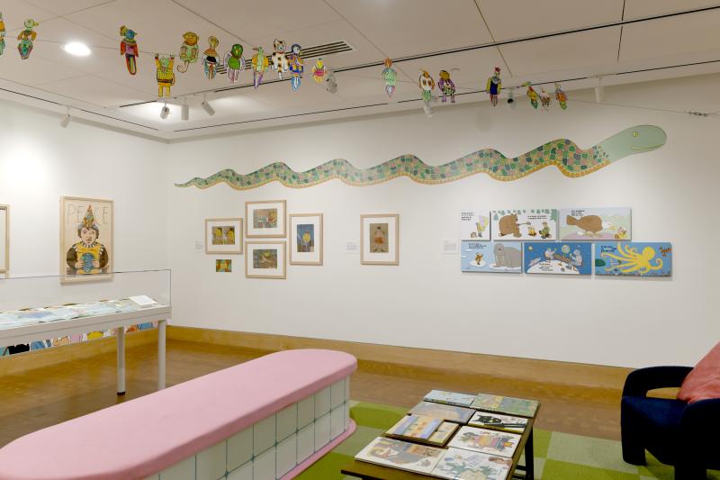 Photograph of gallery showing framed art and graphics.