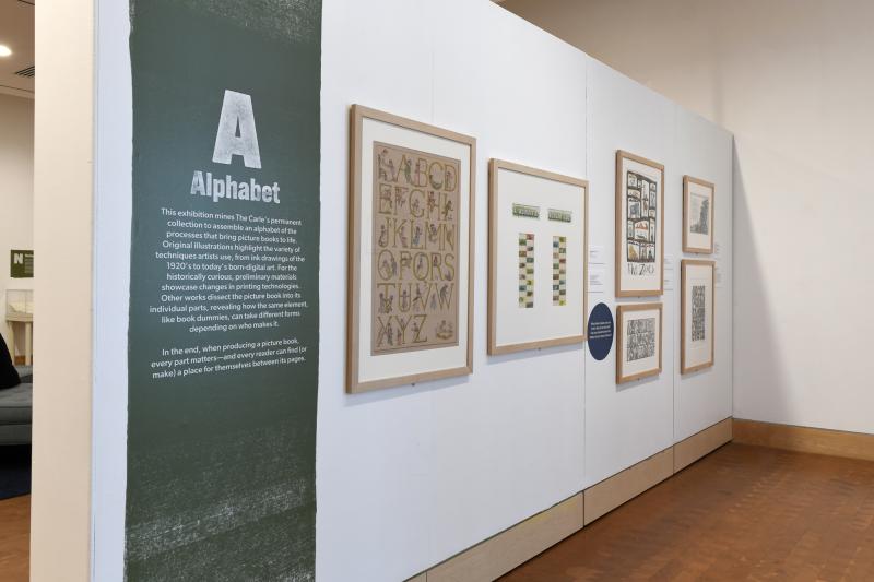 Photograph of gallery showing framed art and graphics.