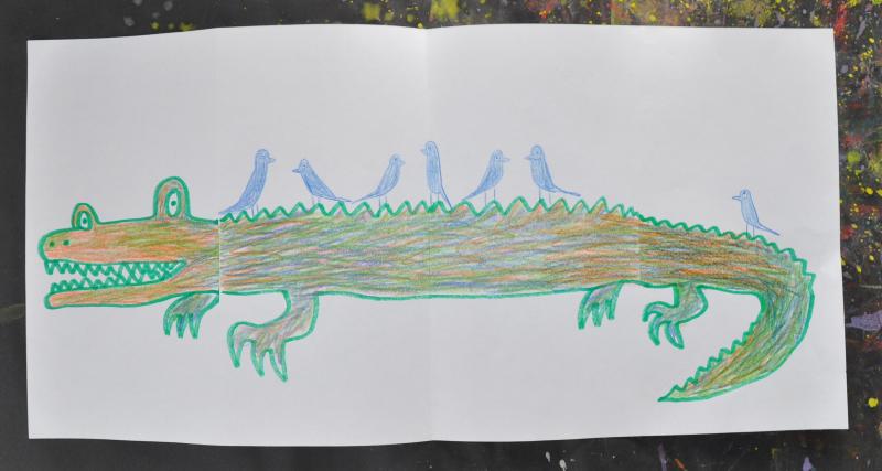Larger, longer image of the crocodile, revealing six more blue birds on the crocodiles back!