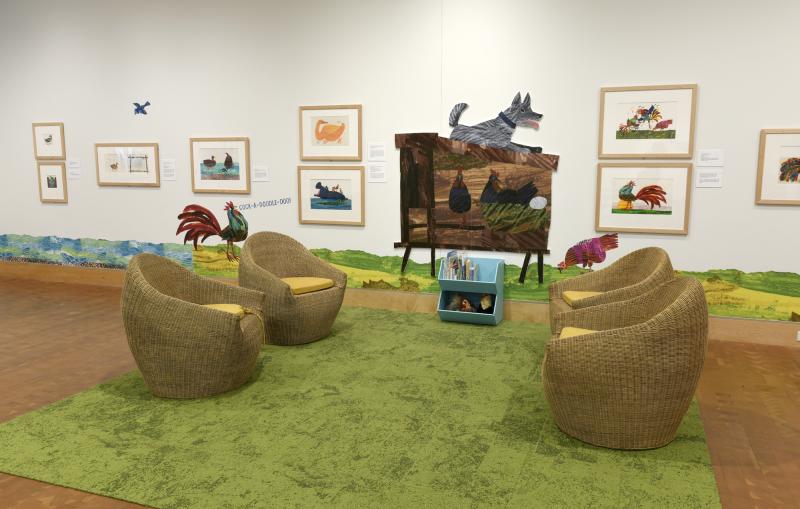 Photograph of gallery showing framed art and graphics.