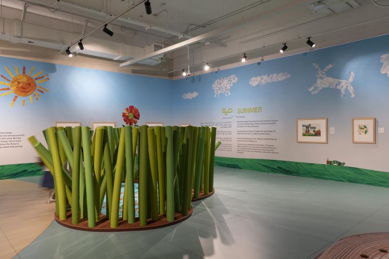 Photograph of gallery showing framed art and graphics.