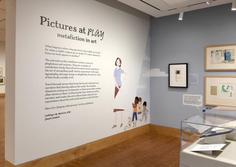 Photograph of gallery showing framed art and graphics.