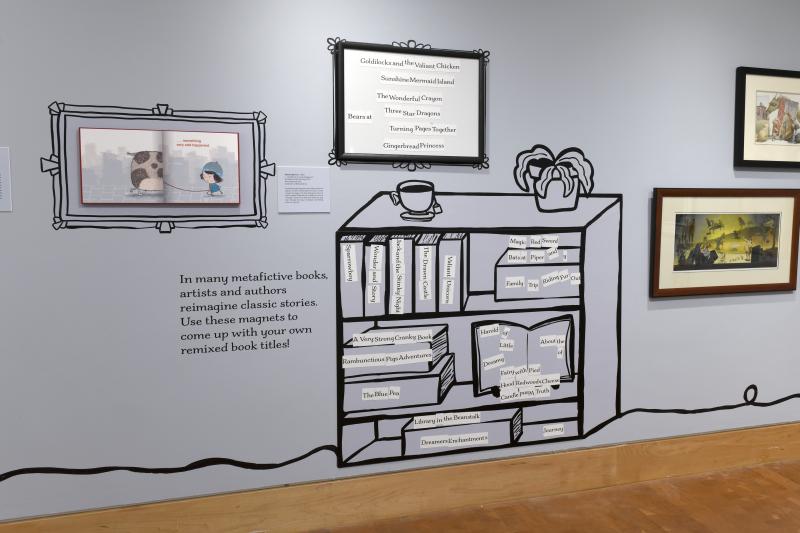 Photograph of gallery showing framed art and graphics.