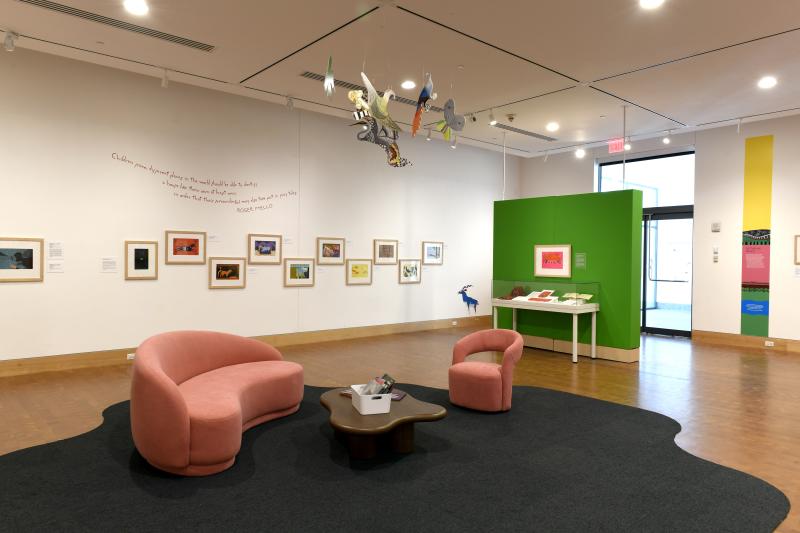 Photograph of gallery showing framed art and graphics.