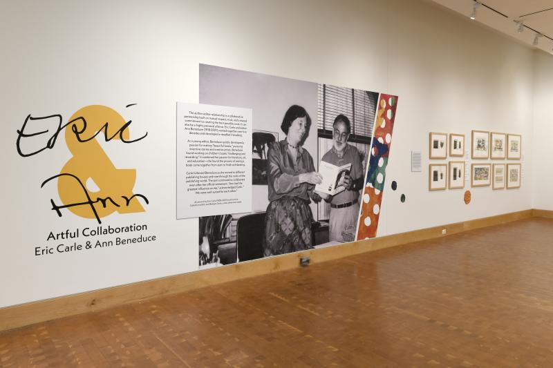 Photograph of gallery showing framed art and graphics.