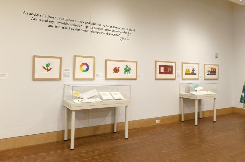 Photograph of gallery showing framed art and graphics.