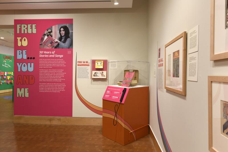 Photograph of gallery showing framed art and graphics.