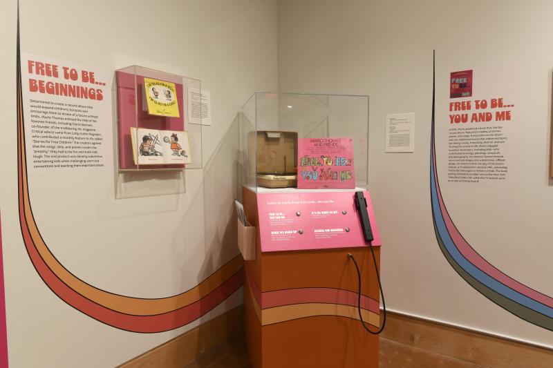 Photograph of gallery showing framed art and graphics.