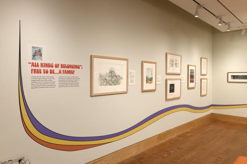 Photograph of gallery showing framed art and graphics.