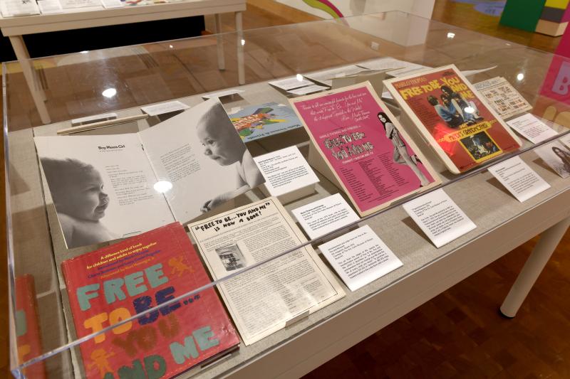 Photograph of gallery showing framed art and graphics.