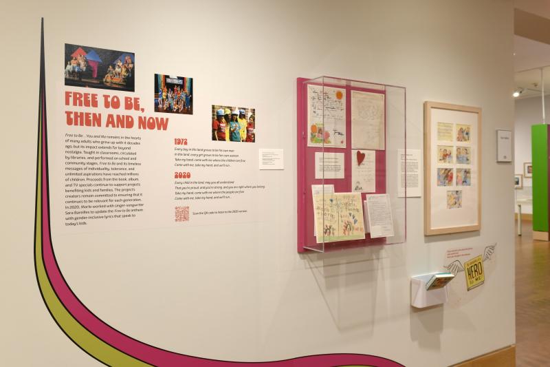 Photograph of gallery showing framed art and graphics.