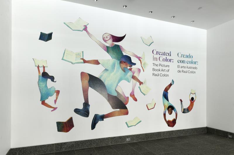 Photograph of gallery showing framed art and graphics.