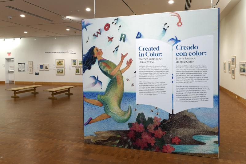 Photograph of gallery showing framed art and graphics.