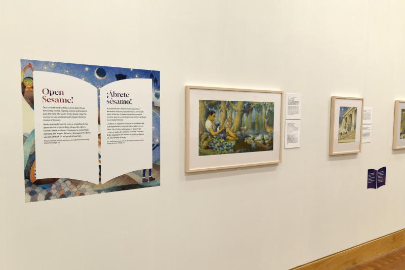 Photograph of gallery showing framed art and graphics.