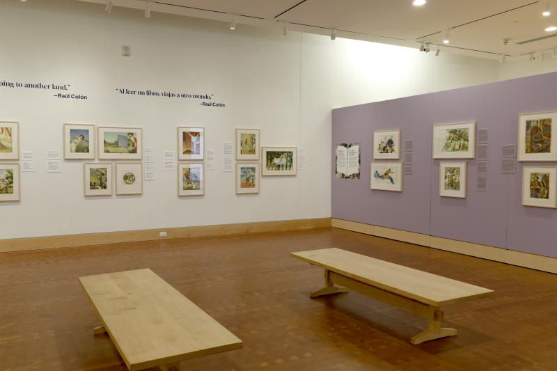 Photograph of gallery showing framed art and graphics.