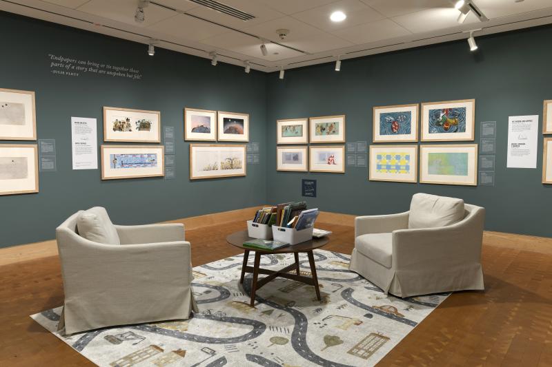 Photograph of gallery showing framed art and graphics.