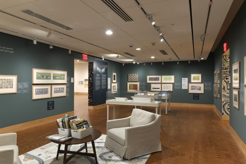Photograph of gallery showing framed art and graphics.