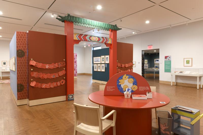 Photograph of gallery showing framed art and graphics.