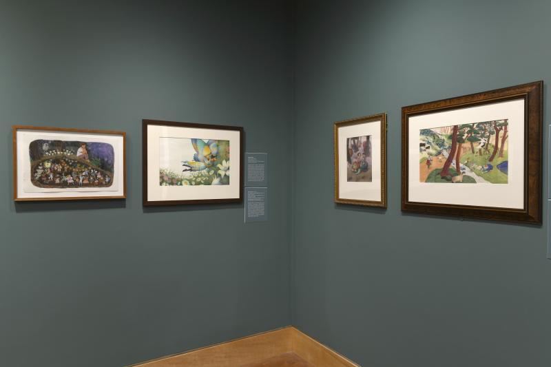 Photograph of gallery showing framed art and graphics.