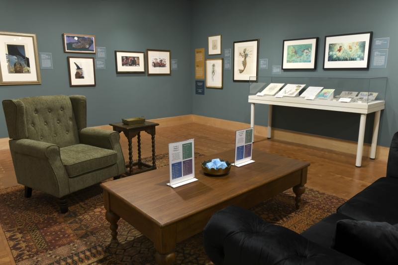 Photograph of gallery showing framed art and graphics.