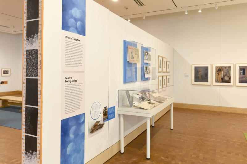 Photograph of gallery showing framed art and graphics.