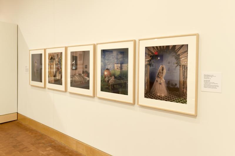 Photograph of gallery showing framed art and graphics.