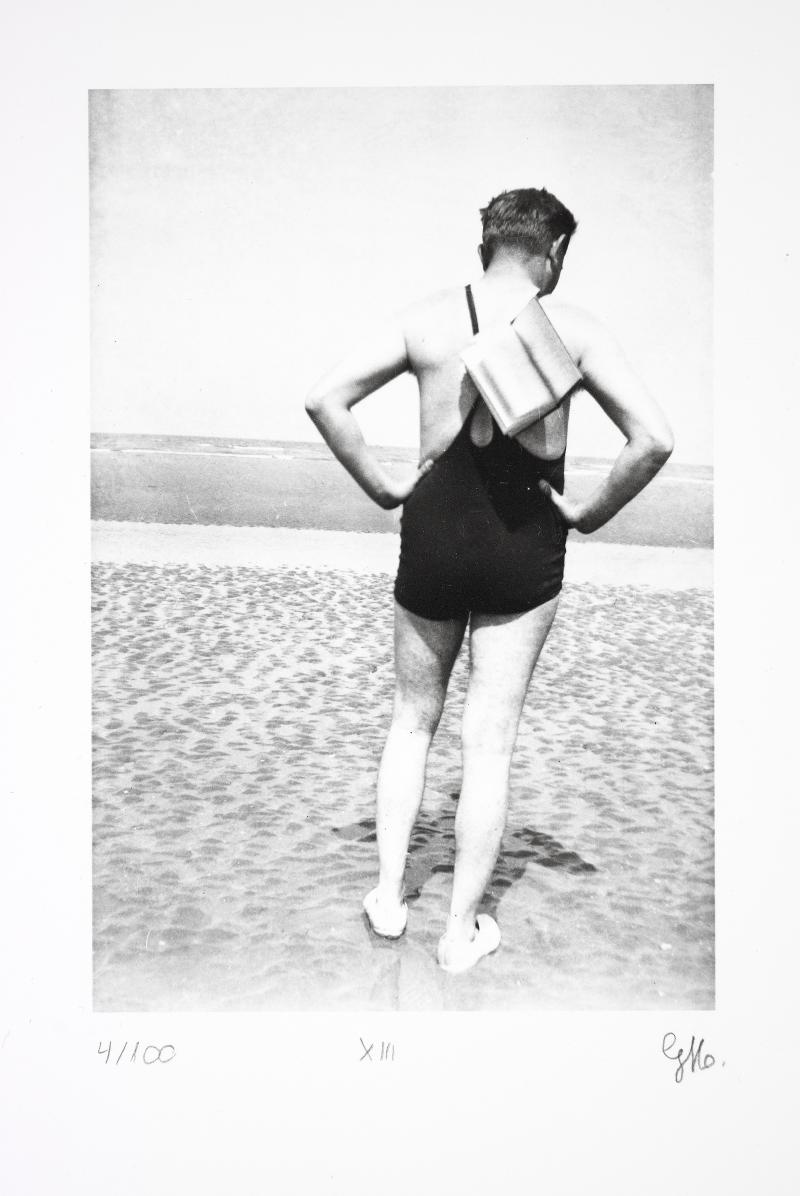 Photograph of boy on beach.